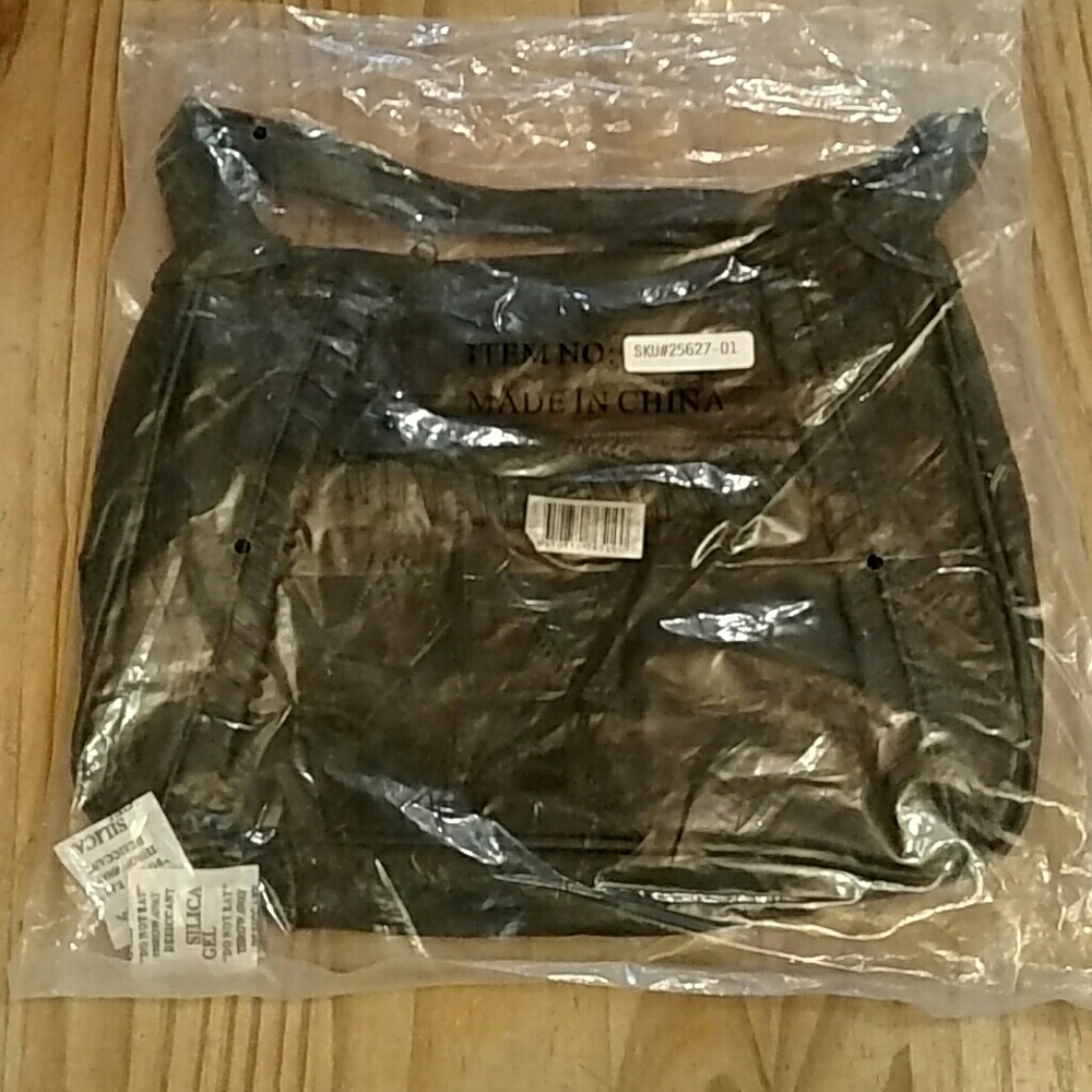 NWT black purse still sealed in bag!
